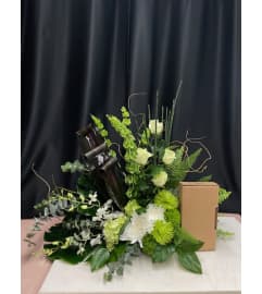 Custom Cremation Arrangement. An arrangement by Marianne's Floral Garden.