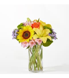 Basking in the Glow Bouquet. An arrangement by North Liberty Flower Shop.