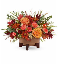 Modern Copper Centerpiece. An arrangement by North Liberty Flower Shop.