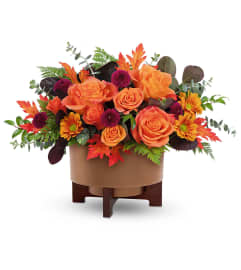 Fall For Copper Centerpiece. An arrangement by North Liberty Flower Shop.