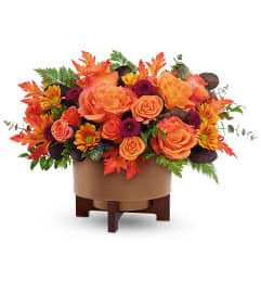 Fall For Copper Centerpiece. An arrangement by North Liberty Flower Shop.