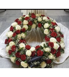 Forever in Bloom Wreath. An arrangement by New Britain Flower Shop.