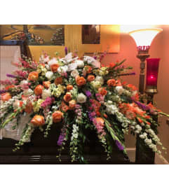 Heavenly Sunset Tribute. An arrangement by New Britain Flower Shop.
