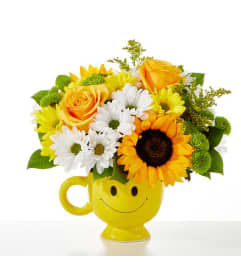 Be Happy Bouquet. An arrangement by North Liberty Flower Shop.