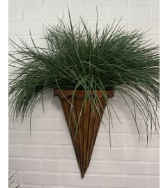 Wall Sconce. An arrangement by The Flower Box Florist.