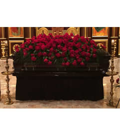 Crimson Grace Casket Spray. An arrangement by Simply Beautiful Flowers and Events.