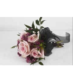 Homecoming Handheld. An arrangement by Flowers by Evie. Homecoming Handheld. An arrangement by Flowers by Evie.