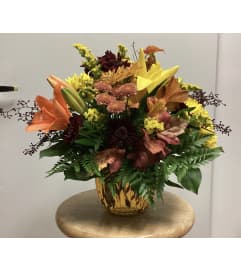 Glass Fall Arrangement. An arrangement by Roma Flowers and Gifts.
