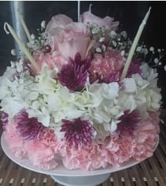 Whispering Bloom Cake. An arrangement by Howard Beach Florist.