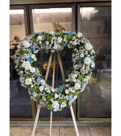 Serene Rose Remembrance. An arrangement by Botanica and Flowers.