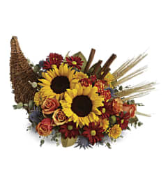 Warm Wishes Cornucopia. An arrangement by Flore's Shop.