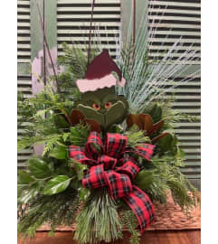 Grinch Outdoor Winter Greenery Arrangement. An arrangement by Forest Florist. Grinch Outdoor Winter Greenery Arrangement. An arrangement by Forest Florist.
