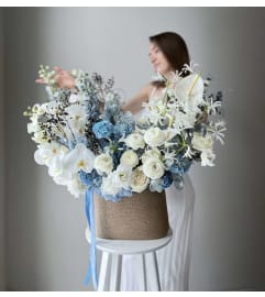 #42 Raya Basket. An arrangement by Blossy Flowers.