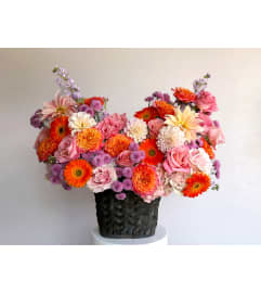 #31 FANCY. An arrangement by Blossy Flowers.