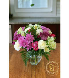 Blooming with Love Arrangement. An arrangement by Anderson Flowers.