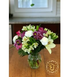 Blooming with Love Arrangement. An arrangement by Lori's Hearts and Flowers. Blooming with Love Arrangement. An arrangement by Lori's Hearts and Flowers.