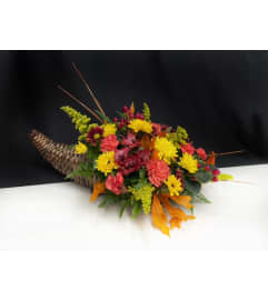 Thanksgiving Cornicopia. An arrangement by Marianne's Floral Garden. Thanksgiving Cornicopia. An arrangement by Marianne's Floral Garden.