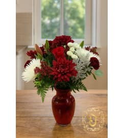 Crimson and Snow Holiday Vase. An arrangement by Lori's Hearts and Flowers.