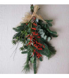 Winter Door Swag (Assorted Themes). An arrangement by Osborne Florist.