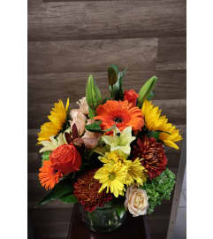 Bright Harvest Blooms. An arrangement by Sonia's Florist.