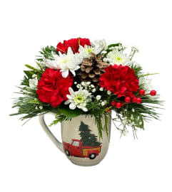Mug Full of Merry. An arrangement by Fendley Florists.
