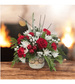 Santa's Holiday Cheer. An arrangement by Loyalist Flowers.