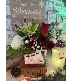 Sleigh Bells. An arrangement by Kelly Ann's Floral.