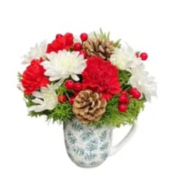 Mug Full of Merry. An arrangement by Fendley Florists.