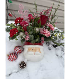 Best Seller Pink Santa. An arrangement by Kelly Ann's Floral.