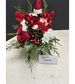 Santa Sleigh. An arrangement by Flowers by Frances. Santa Sleigh. An arrangement by Flowers by Frances.