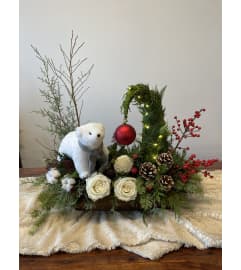 WHISPERING WINTER PINE. An arrangement by Red Rose Incredible Florist. WHISPERING WINTER PINE. An arrangement by Red Rose Incredible Florist.
