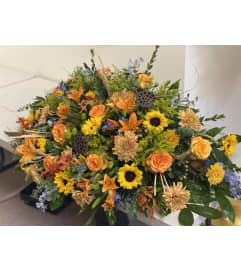 Autumn tribute, Casket Spray. An arrangement by Tom's Florist. Autumn tribute, Casket Spray. An arrangement by Tom's Florist.