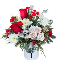 Caroling in the Snow. An arrangement by Azi Flowers.