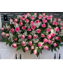 Pink Rose Tribute Casket Spray. An arrangement by Tom's Florist. Pink Rose Tribute Casket Spray. An arrangement by Tom's Florist.