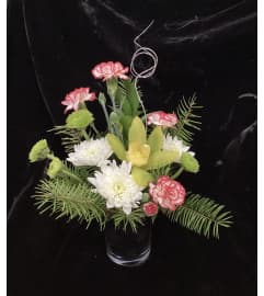 Pretty Orchid Christmas Design. An arrangement by Roma Flowers and Gifts.