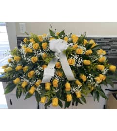 Yellow Rose Tribute Casket Spray. An arrangement by Tom's Florist. Yellow Rose Tribute Casket Spray. An arrangement by Tom's Florist.