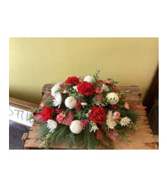 Holiday table centerpiece arrangement. An arrangement by Nicol Florist.