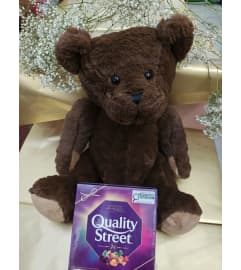 Quality Street and Teddy. An arrangement by KW Flowers.