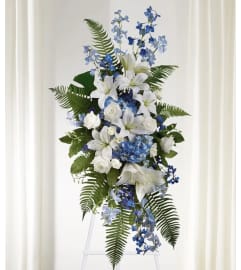 Heavenly Blue Remembrance. An arrangement by Geni's Florist and Gifts.