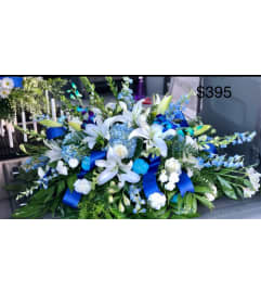 Blue and white Serenity, Casket Spray. An arrangement by Tom's Florist.