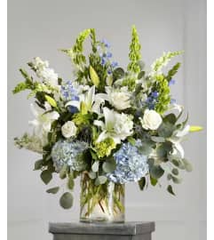 Blues Serene Lilies and Roses. An arrangement by Geni's Florist and Gifts. Blues Serene Lilies and Roses. An arrangement by Geni's Florist and Gifts.