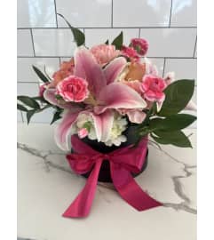 Hat Box Bouquet. An arrangement by Brookdale Flowers and Gifts.