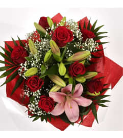 Blush and Bloom Delight. An arrangement by The Floral Basket. Blush and Bloom Delight. An arrangement by The Floral Basket.