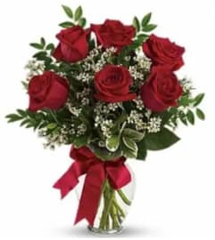 Crimson Love and Grace. An arrangement by The Floral Basket. Crimson Love and Grace. An arrangement by The Floral Basket.
