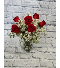 6 Red Roses Arranged in a Cylinder. An arrangement by Clemmons Florist Inc.. 6 Red Roses Arranged in a Cylinder. An arrangement by Clemmons Florist Inc..