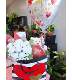 Valentine's Day Bundle Bag. An arrangement by Palmetto Blossom.