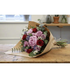 Florist's Choice Valentine's Day Wrapped Bouquet. An arrangement by DMP Flowers and Gifts. Florist's Choice Valentine's Day Wrapped Bouquet. An arrangement by DMP Flowers and Gifts.