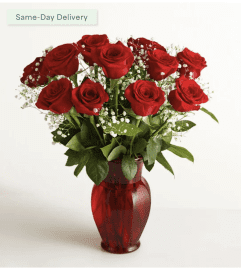 Blooming Love 12 RED ROSES. An arrangement by Sicola's Florist.