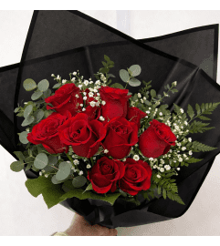 Romantic Red Roses Wrapped in Black. An arrangement by Avenida Flowers.