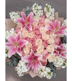 Lily Kissed Romance. An arrangement by Geni's Florist and Gifts.